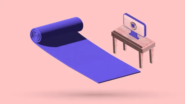 A 3D yoga mat unrolled on the floor beside a small desk and monitor